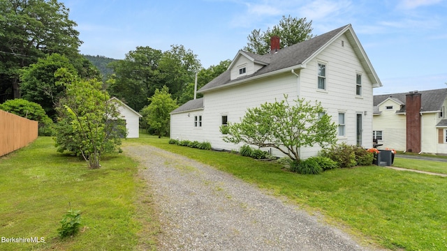 370 Park St, Great Barrington, MA 01236 - view of side of property with roof with shingles, a chimney, and gravel driveway