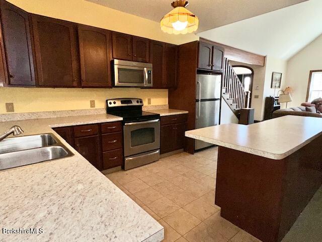 791 Partridge Rd, Lanesborough, MA 01237 - kitchen featuring appliances with stainless steel finishes, a sink, dark brown cabinets, light countertops, and vaulted ceiling