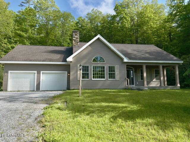 791 Partridge Rd, Lanesborough, MA 01237 - view of front of house featuring covered porch, a garage, a front lawn, driveway, and a chimney