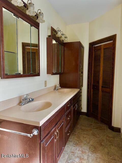 791 Partridge Rd, Lanesborough, MA 01237 - bathroom with double vanity and baseboards