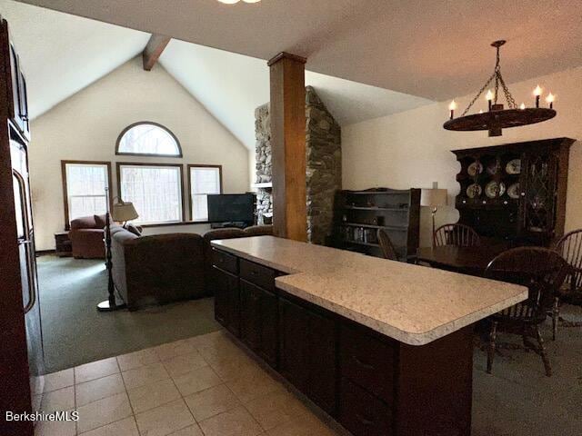 791 Partridge Rd, Lanesborough, MA 01237 - kitchen featuring a chandelier, open floor plan, a center island, light countertops, and dark brown cabinetry