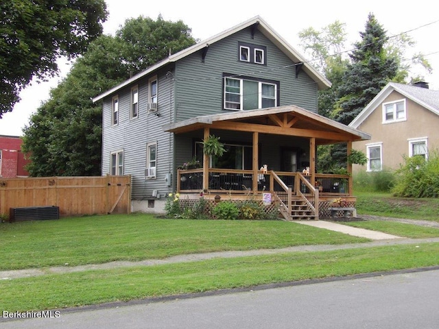 view of front of property featuring a porch and a front yard