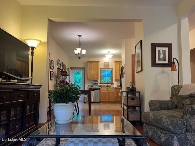 8 Stanley Dr Unit A-4, Great Barrington, MA 01230 - living area with a chandelier and light wood finished floors