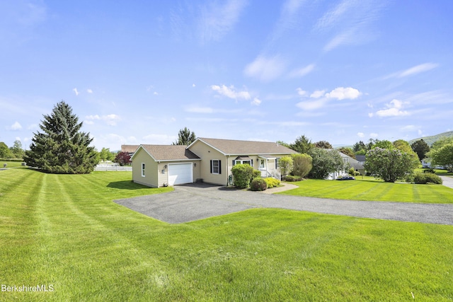 120 Via Maria St, Lee, MA 01238 - ranch-style house featuring a garage, asphalt driveway, and a front lawn