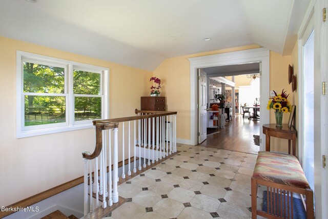 corridor with lofted ceiling