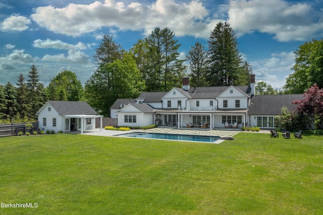1030 W St, Pittsfield, MA 01201 - back of house with french doors, a patio, an outdoor pool, a chimney, and a storage structure