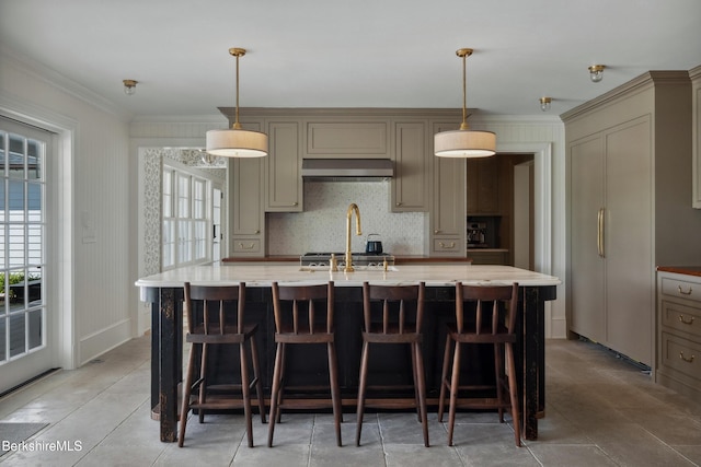 1030 W St, Pittsfield, MA 01201 - kitchen with range hood, ornamental molding, an island with sink, a breakfast bar, and backsplash