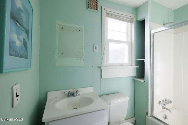 full bath featuring visible vents, combined bath / shower with glass door, toilet, and vanity