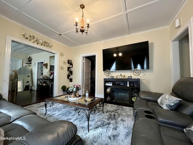 living room featuring an inviting chandelier and crown molding