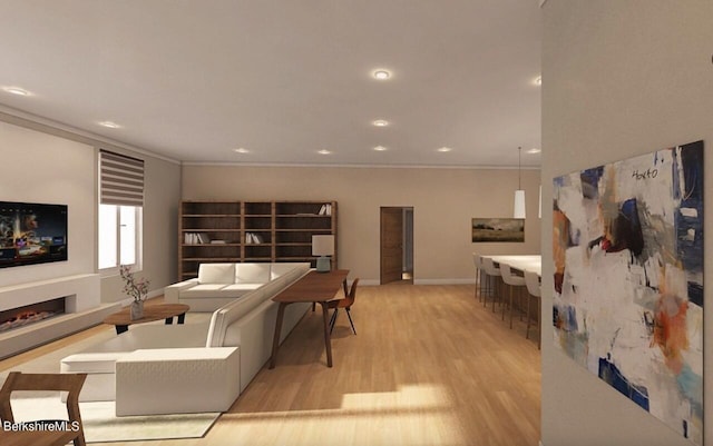 living room with crown molding and light hardwood / wood-style floors