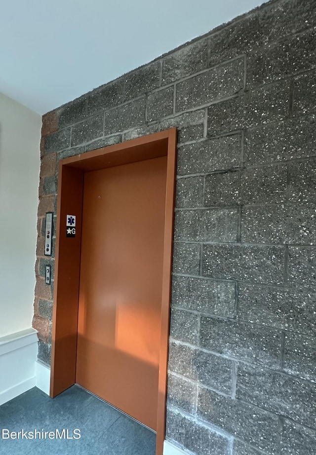 detailed view of elevator and carpet flooring