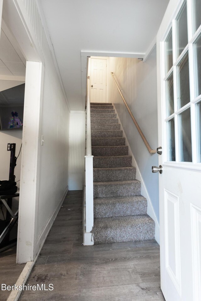 stairway with wood finished floors