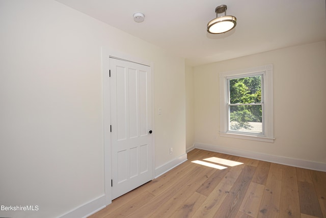 empty room with light hardwood / wood-style floors