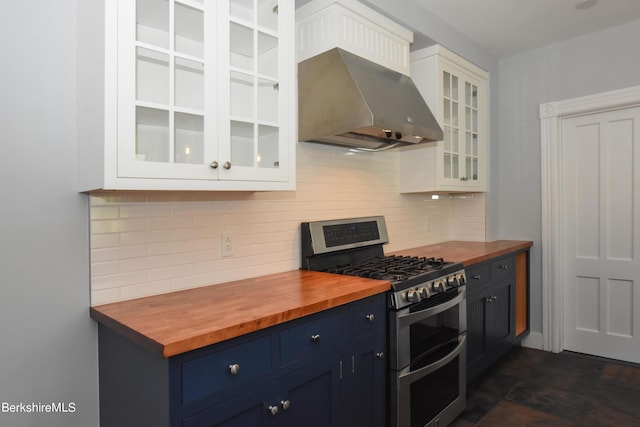 kitchen featuring white cabinets, butcher block countertops, and double oven range