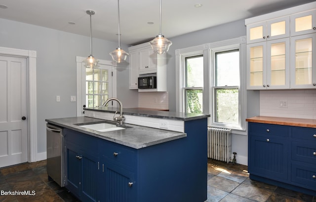 kitchen with radiator, blue cabinets, white cabinetry, and tasteful backsplash