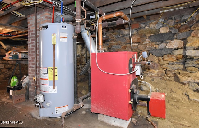 utility room featuring gas water heater