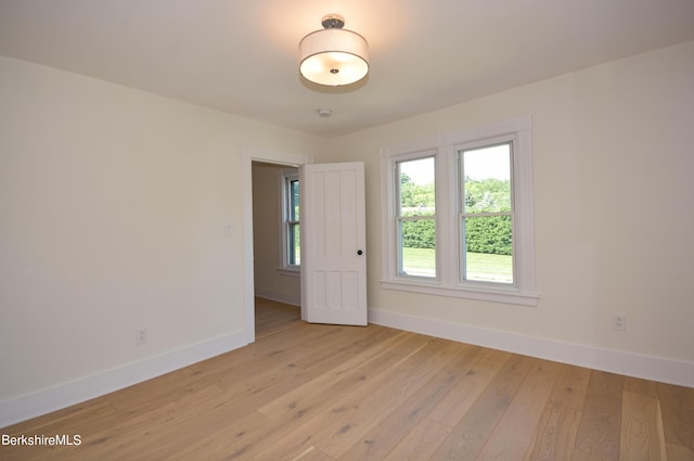 spare room with light hardwood / wood-style floors