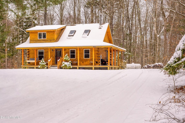 log-style house with covered porch