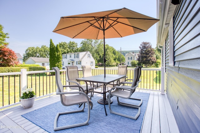 wooden deck with a yard