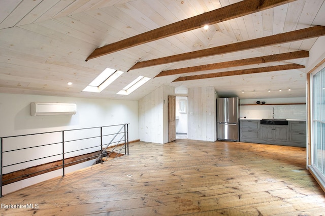 649 Hewins St, Sheffield, MA 01257 - additional living space with a wall mounted air conditioner, wood-type flooring, a skylight, a sink, and wood ceiling