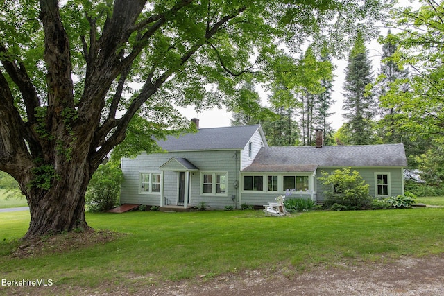 649 Hewins St, Sheffield, MA 01257 - view of front of property with a chimney, roof with shingles, and a front yard