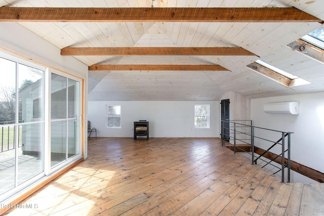 649 Hewins St, Sheffield, MA 01257 - additional living space with an AC wall unit, wood ceiling, hardwood / wood-style floors, and a skylight