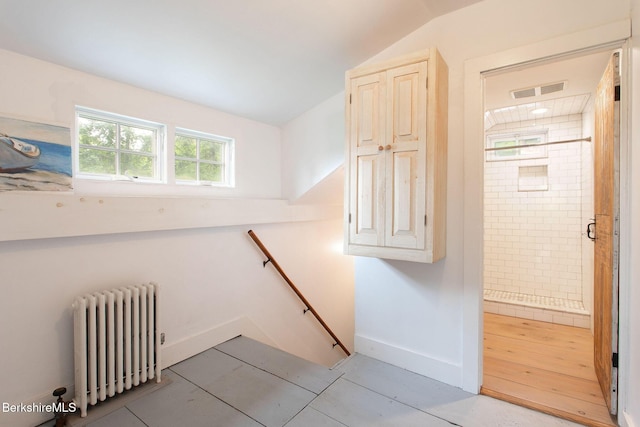 649 Hewins St, Sheffield, MA 01257 - stairs with radiator, vaulted ceiling, baseboards, and tile patterned floors