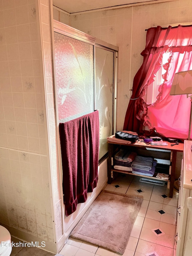 61 E Main Rd, Peru, MA 01235 - bathroom featuring toilet, tile patterned flooring, and combined bath / shower with glass door