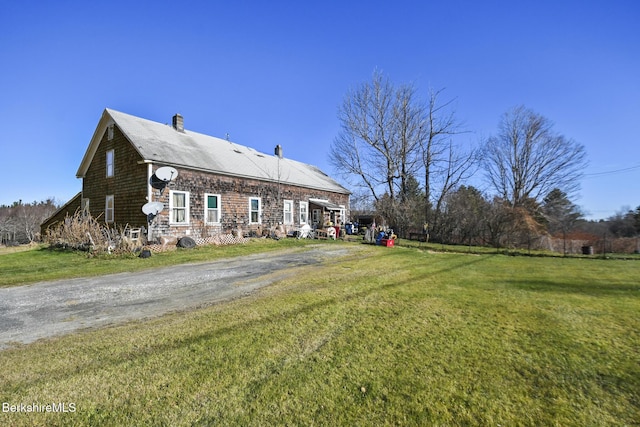 61 E Main Rd, Peru, MA 01235 - rear view of property featuring a lawn and a chimney