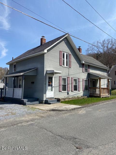 99 Meadow St, North Adams, MA 01247 - exterior space with a chimney and covered porch