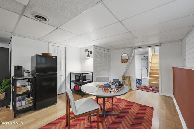 72 Cleveland St, Pittsfield, MA 01201 - dining area featuring a drop ceiling, wood finished floors, and stairs