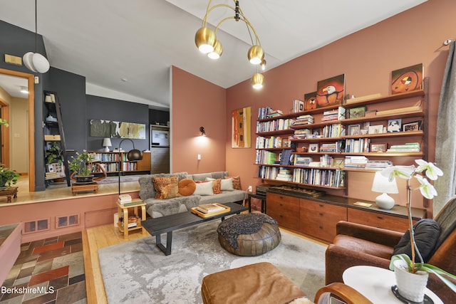 72 Cleveland St, Pittsfield, MA 01201 - living room featuring vaulted ceiling and stone finish floors