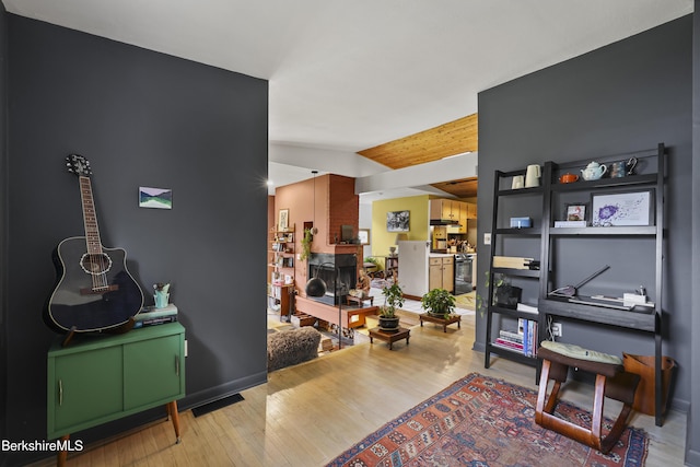 72 Cleveland St, Pittsfield, MA 01201 - living area featuring wood finished floors and vaulted ceiling