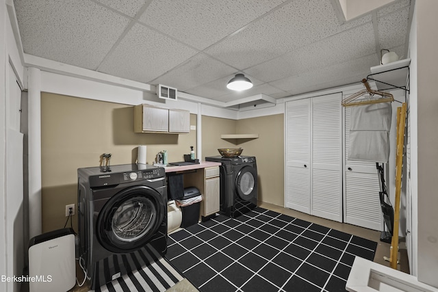 72 Cleveland St, Pittsfield, MA 01201 - laundry room with washer / clothes dryer, cabinet space, and dark tile patterned floors