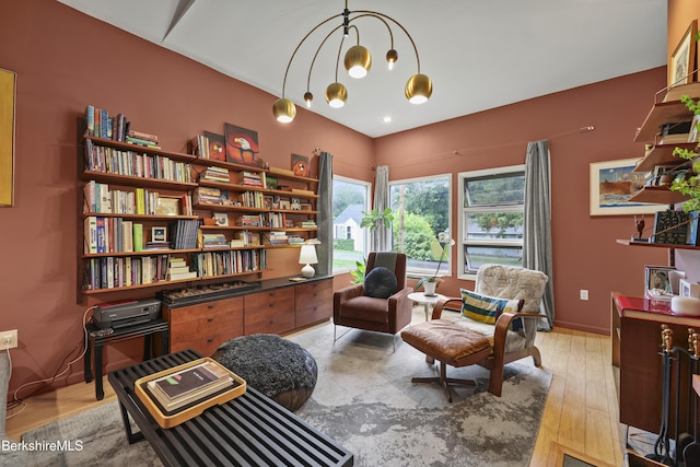 72 Cleveland St, Pittsfield, MA 01201 - living area featuring light wood-type flooring and a chandelier