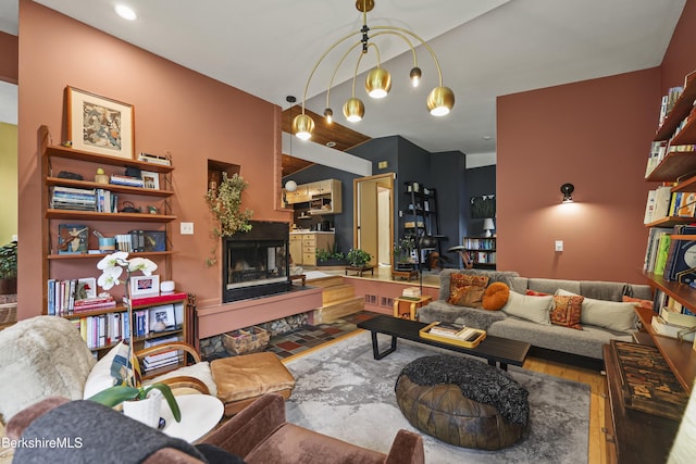 72 Cleveland St, Pittsfield, MA 01201 - living area featuring wood finished floors, a fireplace with raised hearth, and recessed lighting
