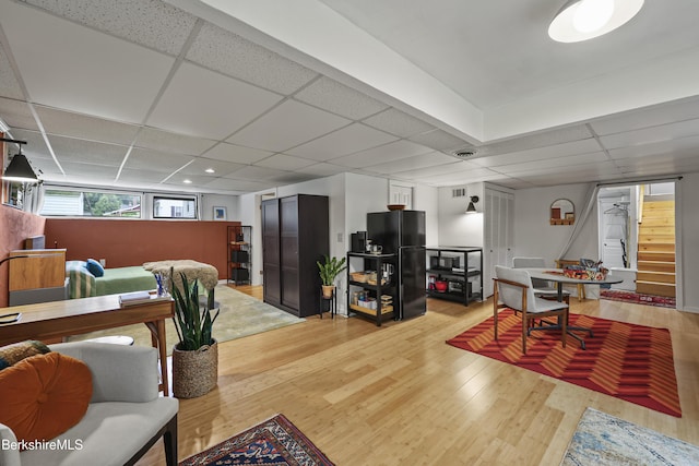 72 Cleveland St, Pittsfield, MA 01201 - living area with a paneled ceiling, stairs, and light wood-type flooring