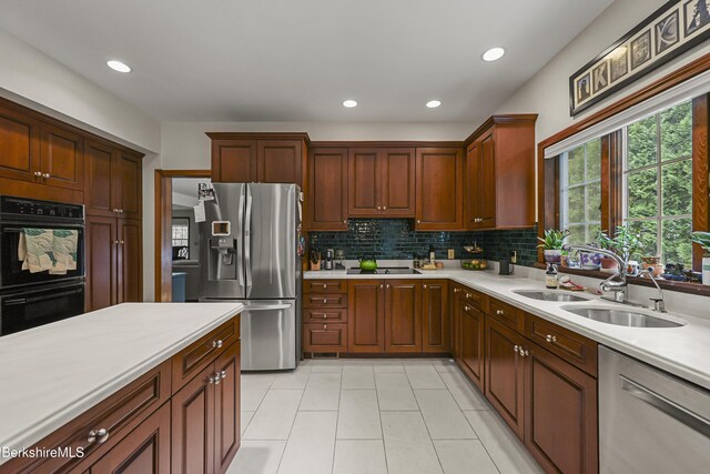 67 Dunmore Ct, Lenox, MA 01240 - kitchen featuring black appliances, light countertops, light tile patterned flooring, backsplash, and recessed lighting