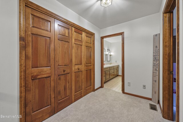 67 Dunmore Ct, Lenox, MA 01240 - hall featuring light colored carpet and baseboards