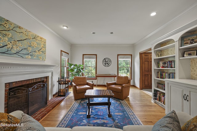 67 Dunmore Ct, Lenox, MA 01240 - living room with light wood-type flooring, crown molding, recessed lighting, and a fireplace