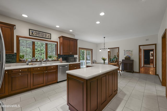 67 Dunmore Ct, Lenox, MA 01240 - kitchen featuring dishwasher, light countertops, decorative backsplash, recessed lighting, and a center island with sink