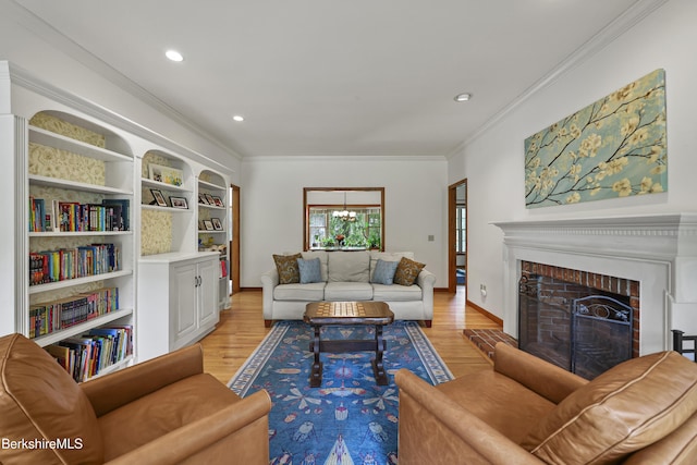 67 Dunmore Ct, Lenox, MA 01240 - living room with light wood-type flooring, a fireplace, crown molding, recessed lighting, and a chandelier