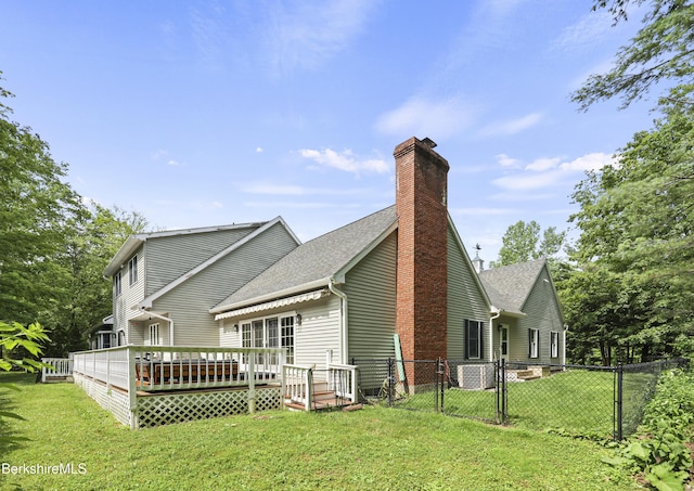 67 Dunmore Ct, Lenox, MA 01240 - back of house featuring a deck, a chimney, roof with shingles, and a gate