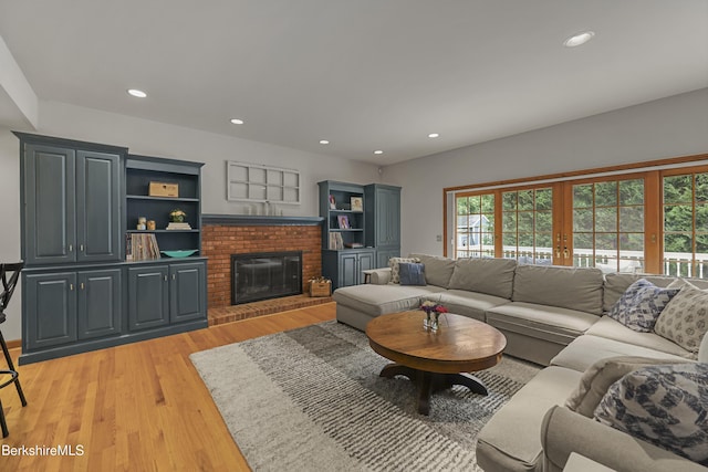 67 Dunmore Ct, Lenox, MA 01240 - living area with light wood-type flooring, a fireplace, and recessed lighting