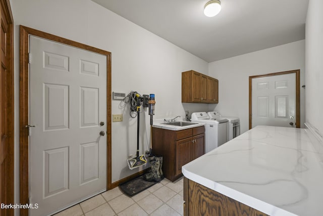 67 Dunmore Ct, Lenox, MA 01240 - laundry room featuring cabinet space, independent washer and dryer, and light tile patterned floors