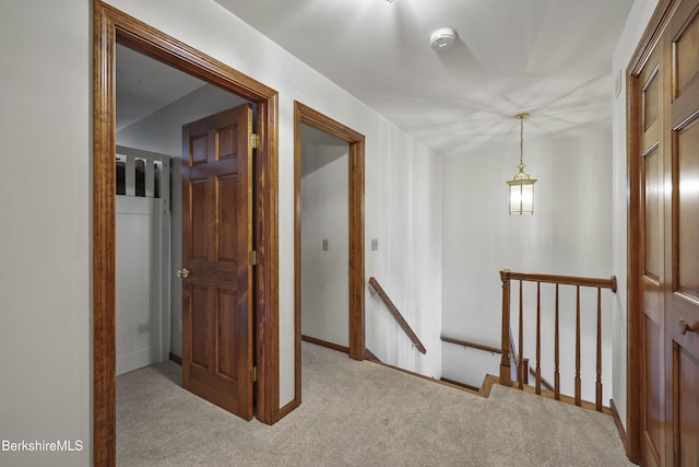 67 Dunmore Ct, Lenox, MA 01240 - corridor featuring an upstairs landing and carpet floors