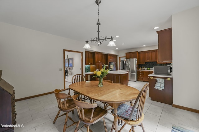 67 Dunmore Ct, Lenox, MA 01240 - dining space featuring recessed lighting, light tile patterned floors, and a chandelier