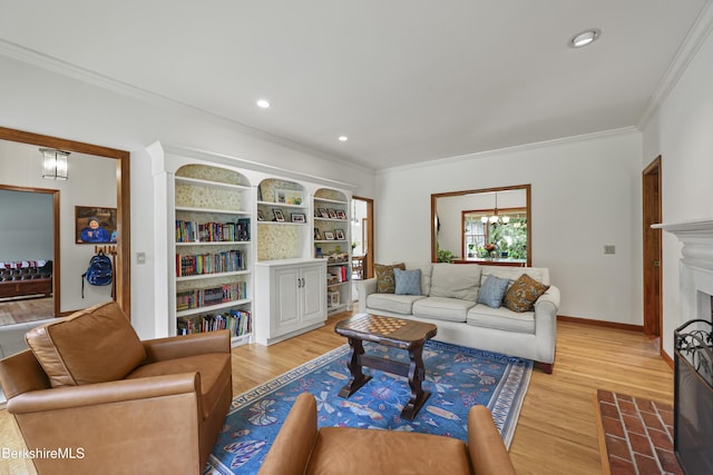 67 Dunmore Ct, Lenox, MA 01240 - living room featuring light wood-type flooring, ornamental molding, a chandelier, a fireplace with flush hearth, and recessed lighting