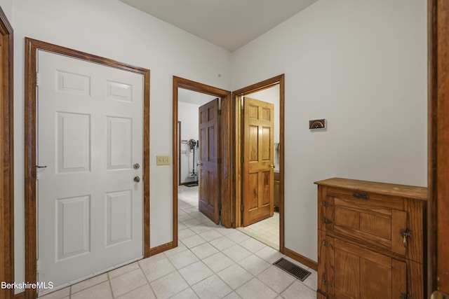 67 Dunmore Ct, Lenox, MA 01240 - hallway featuring baseboards and light tile patterned floors