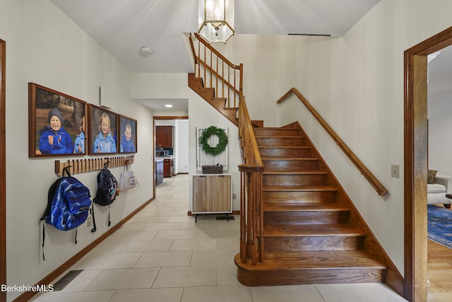 67 Dunmore Ct, Lenox, MA 01240 - stairs featuring tile patterned floors and baseboards